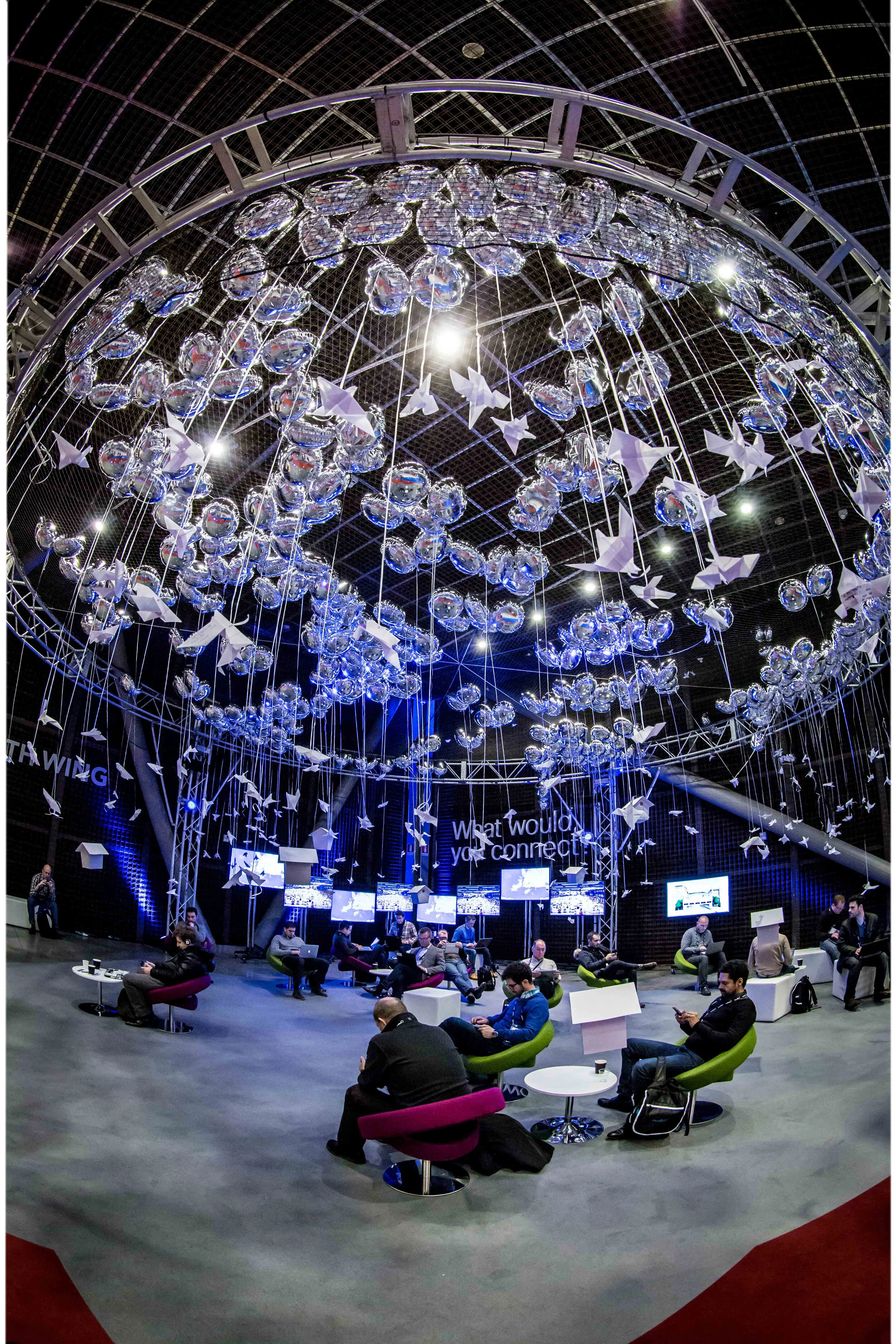Helium balloons and origami birds used to create interactive lounge