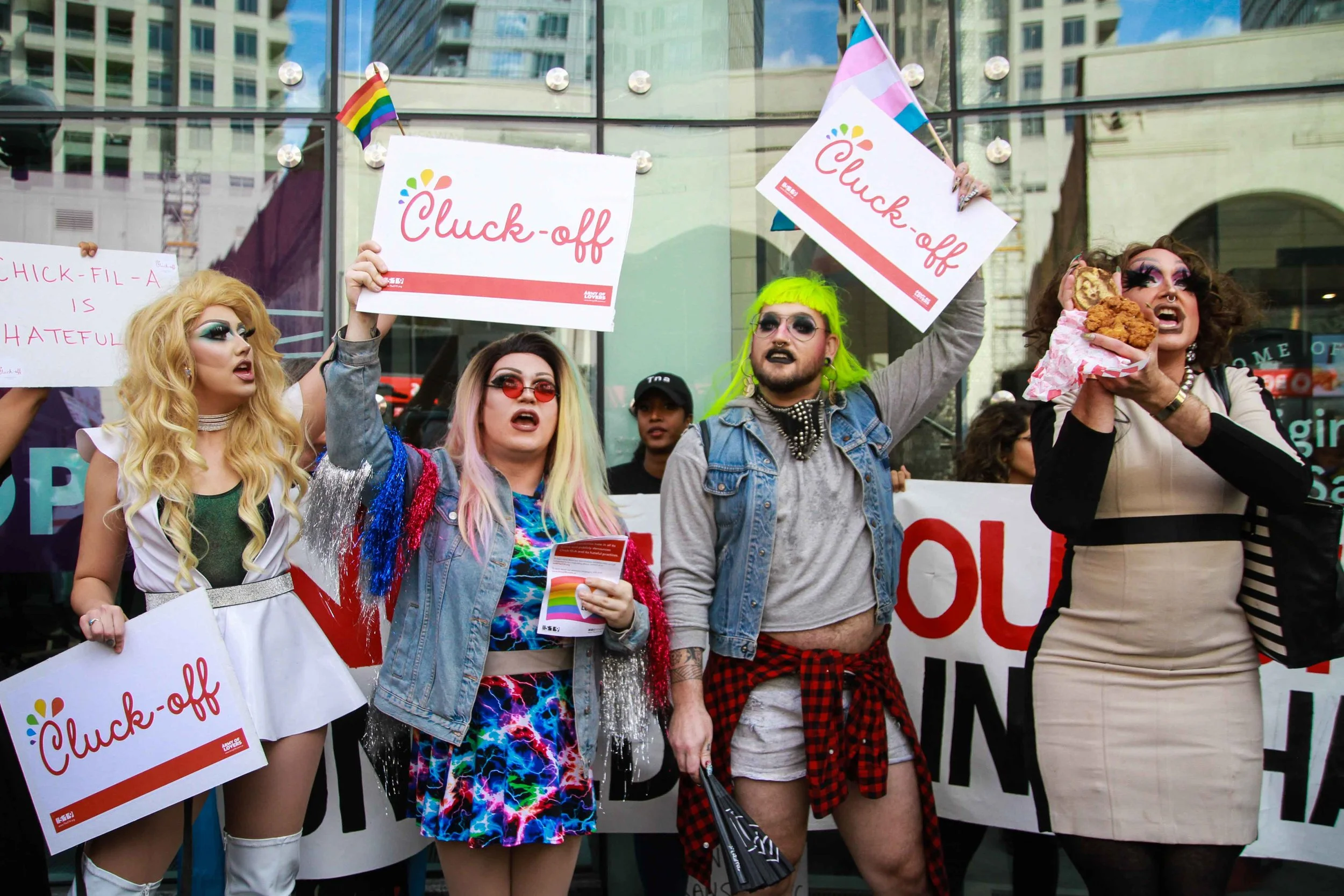 Toronto drag queens (left to right), Tash Riot, Baby Bel Bel, Jacklynne Hyde, and Mikiki, perform as members from The 519 community centre gather in front of Toronto's first Chick-fil-A to protest the opening of the new restaurant, known for its tie