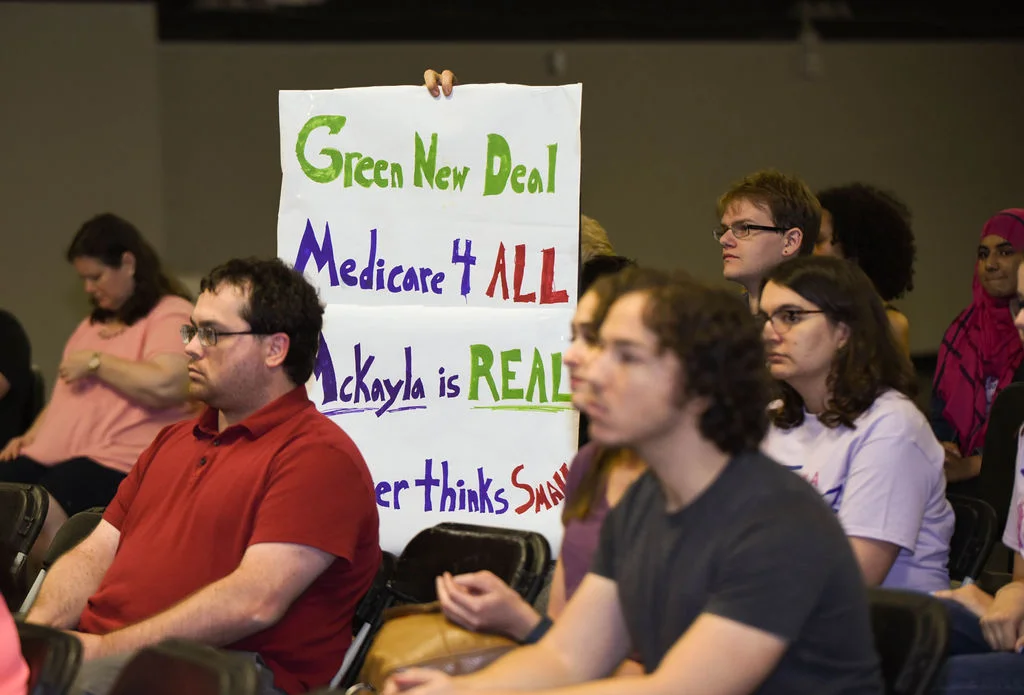 Green New Deal sign at the kickoff