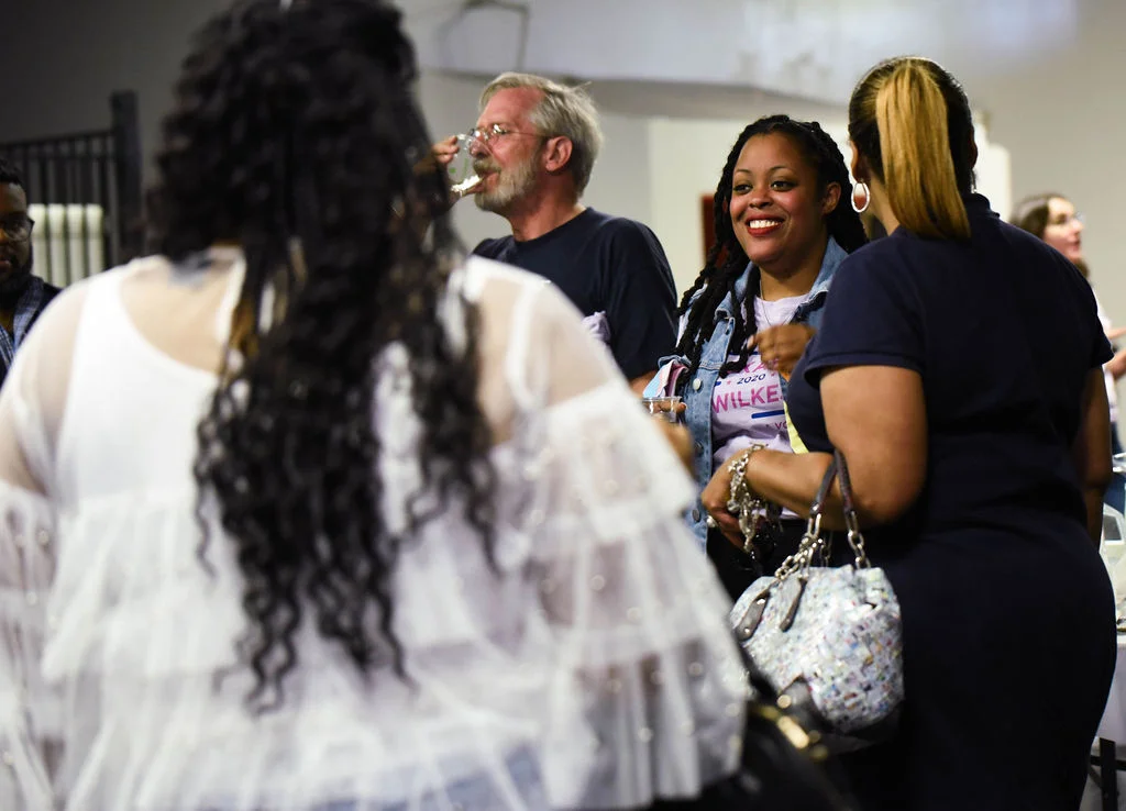 Mckayla speaking with friends at the kickoff