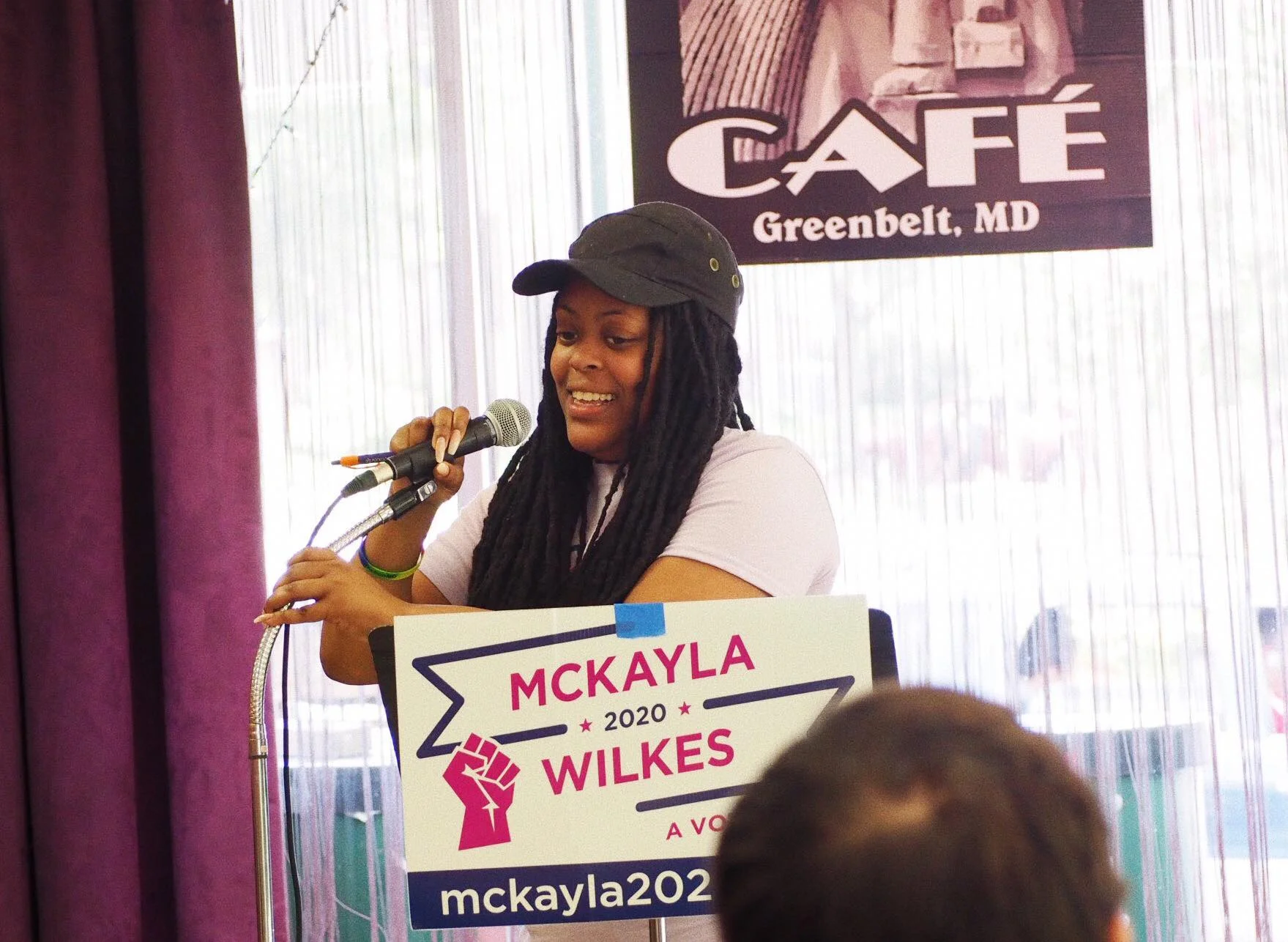 Mckayla speaking at the New Deal Cafe in Greenbelt, Maryland