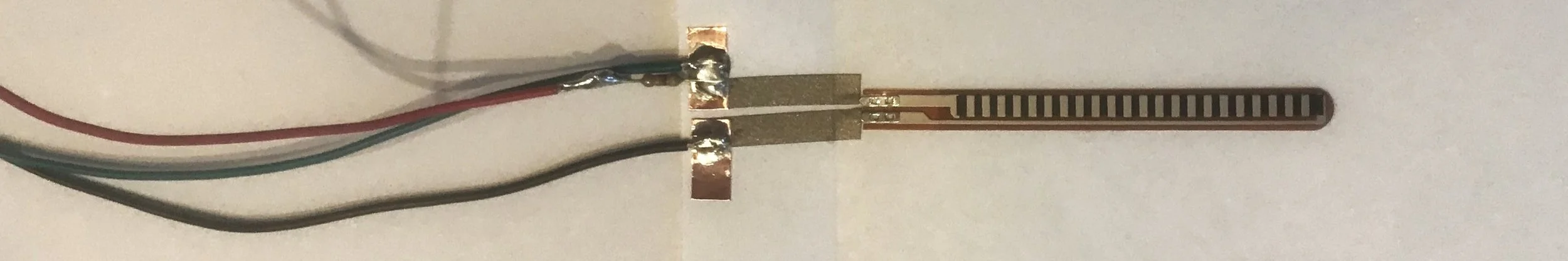 flex sensor, solder, and wires, inside of Face Book page, 2019.