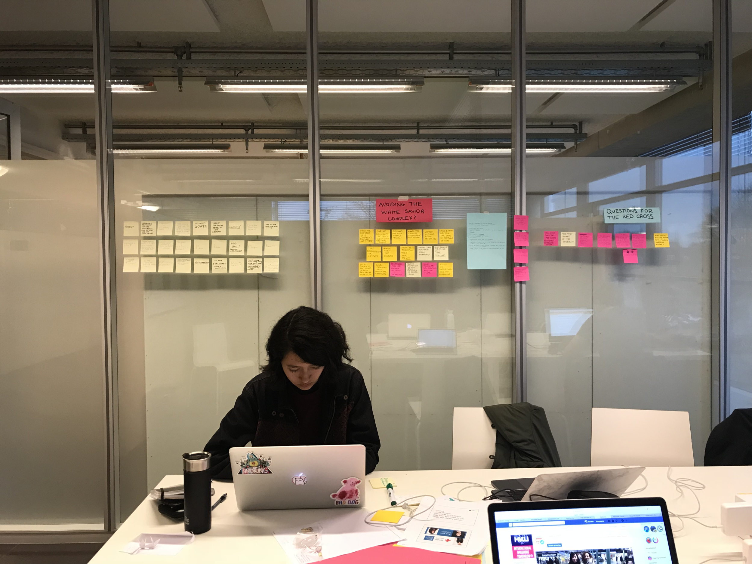 Chanina in front of brainstorming post-its.