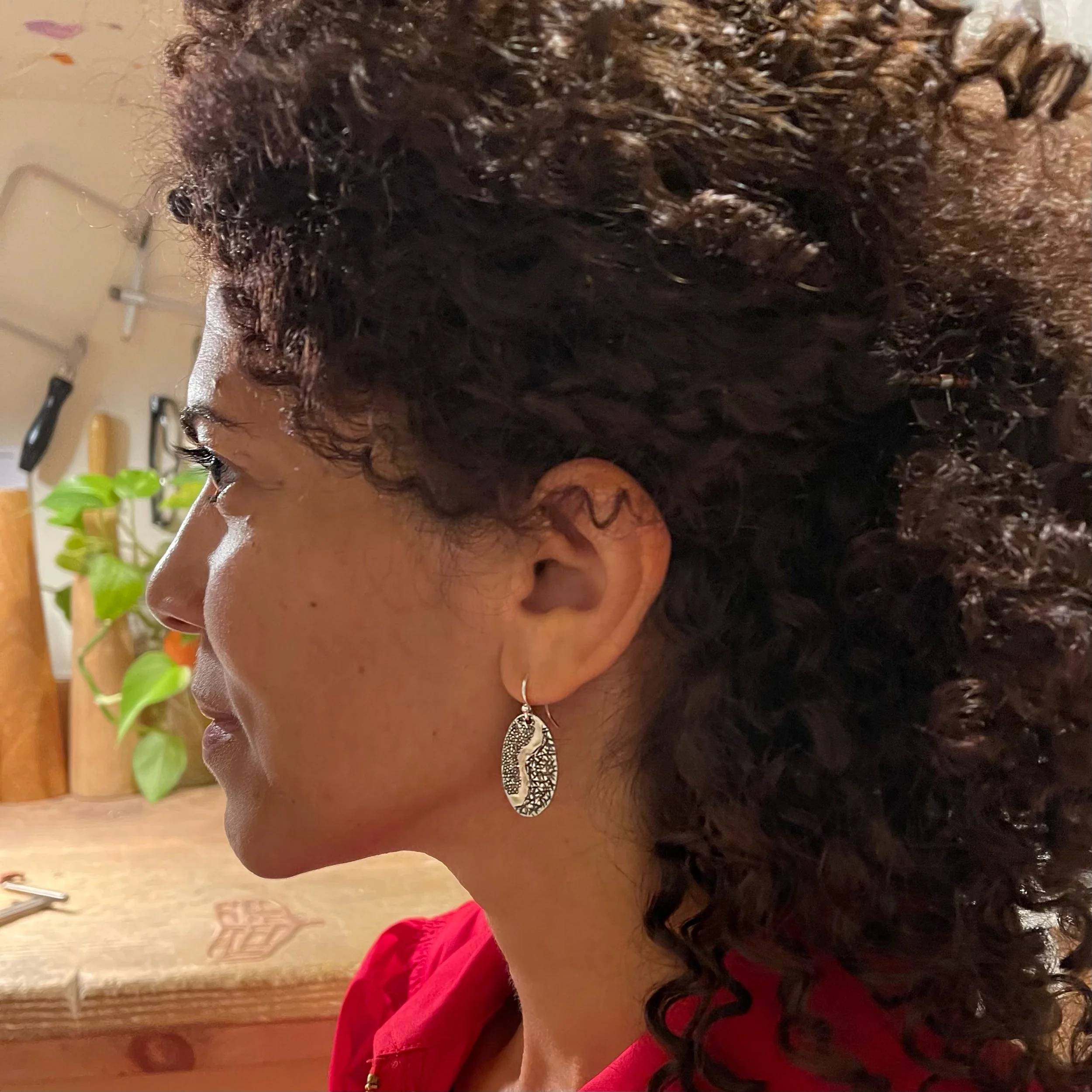 Ripple Earrings on ear.JPG