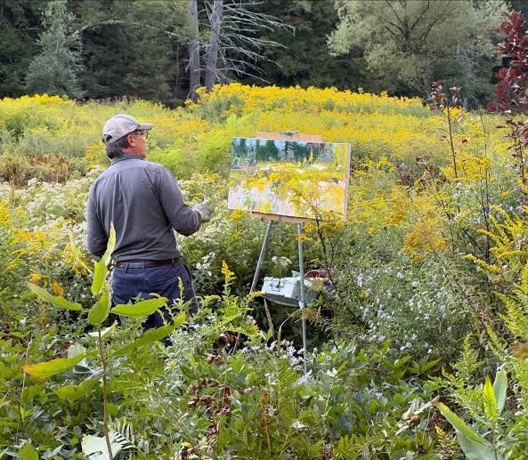 Photo of Eric painting outside #2.jpg