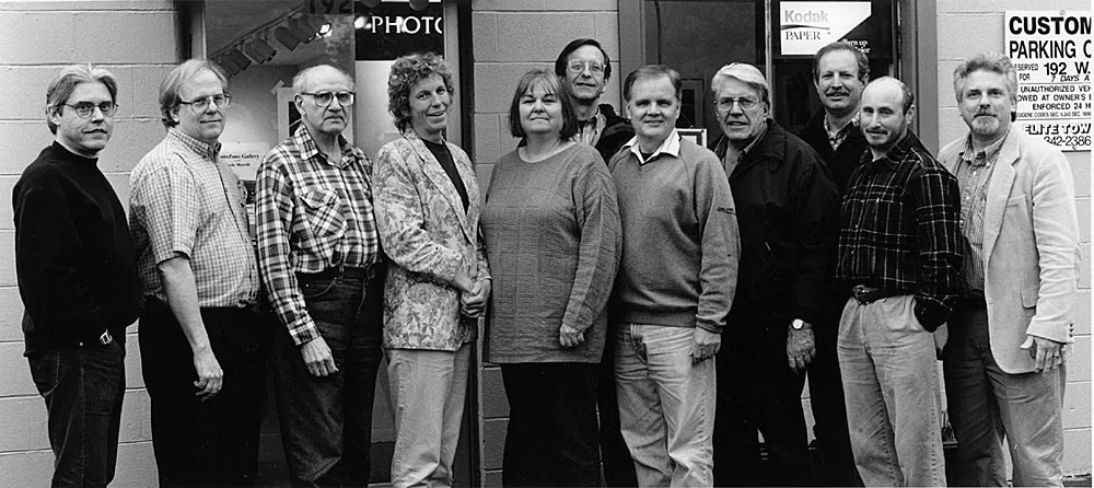 In front of our W.11th Gallery 2000 - 2002 L-R: Justin Williams, Walt O’Brien, Herman Krieger, Susie Morrill, Denise Mattson, John Coggins, Gene Tonry, Chuck Draper, Patrick Plaia, Guy Weese