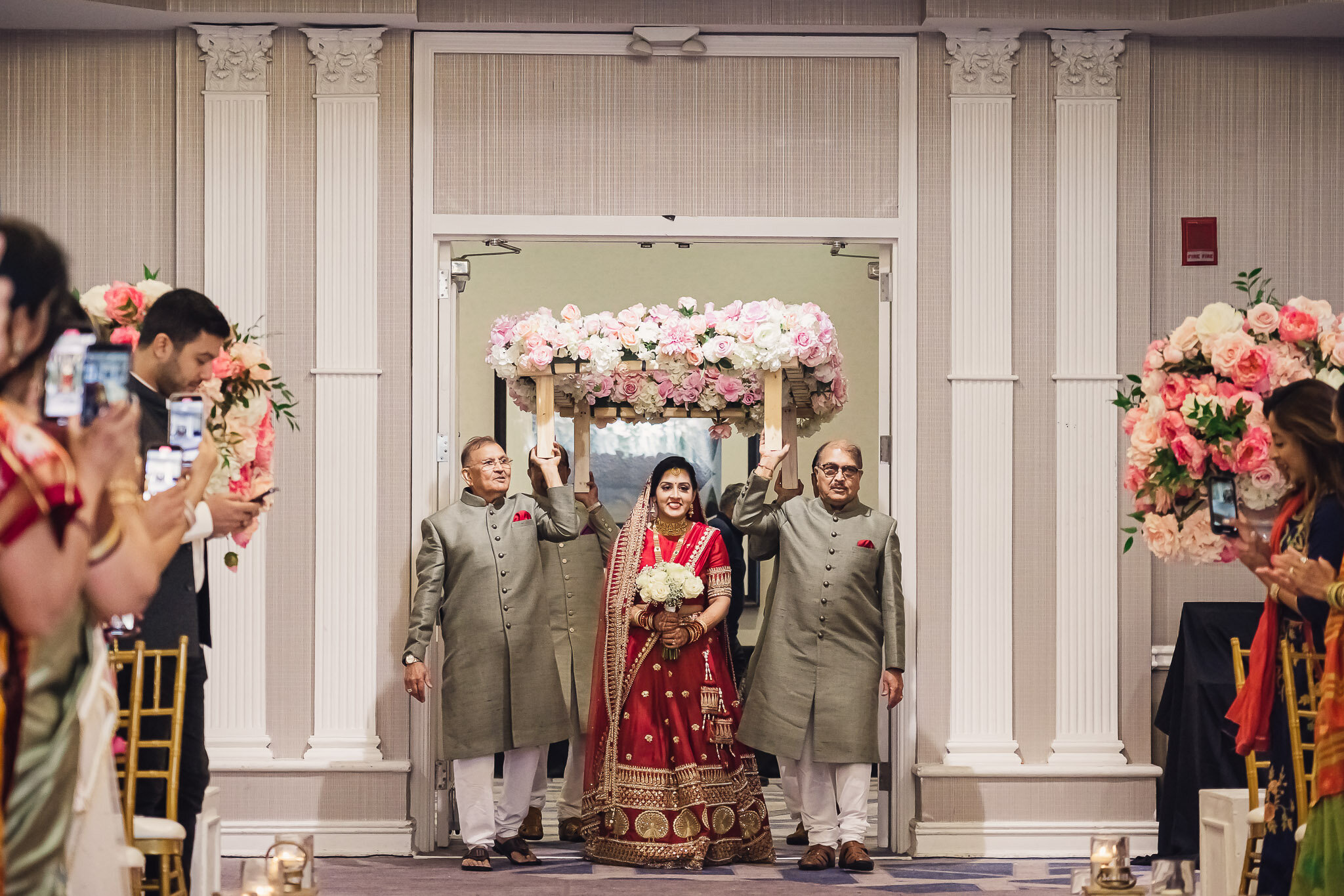 Indian bride and groom walking down the aisle during wedding ceremony