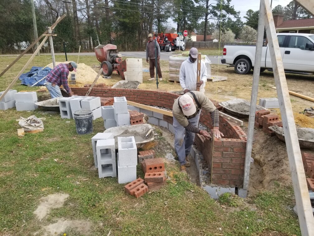  The construction crew begins work on the walls.  Photo courtesy of Dr. Ervin Griffin  
