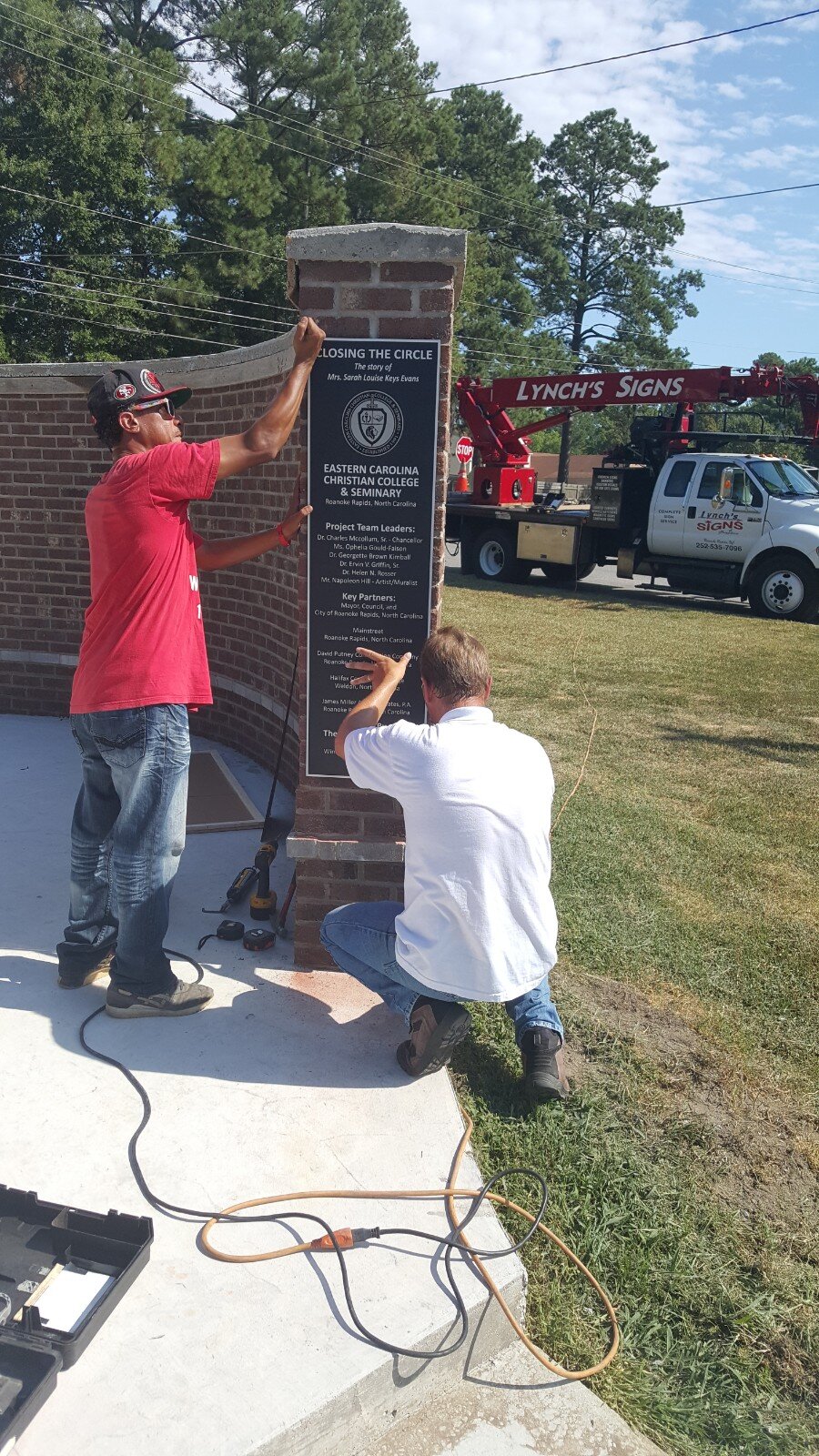  An exciting day as the plaques are installed.  Photo courtesy of Dr. Ervin Griffin  