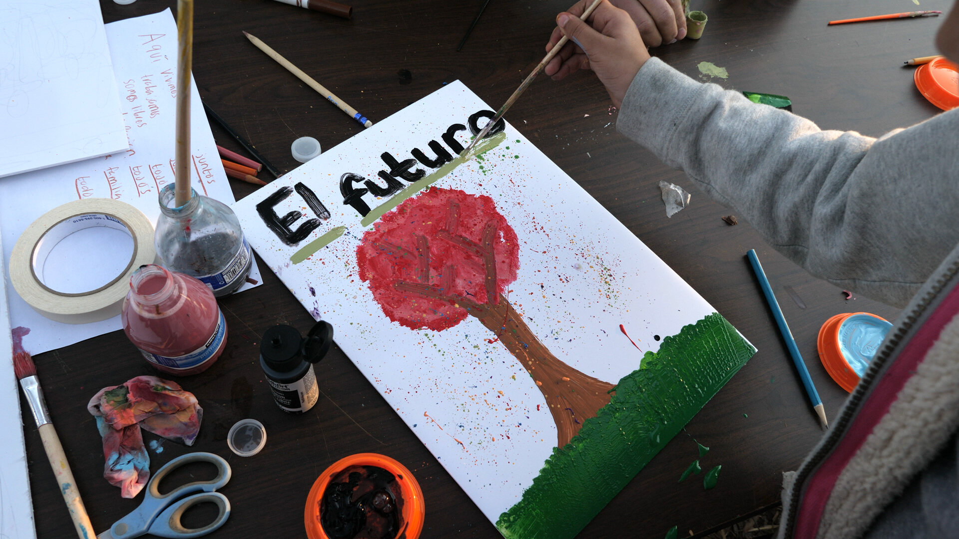  El Futuro launches the project with a community fiesta that incorporates creative activity stations to begin the process of gathering ideas from the community about what they would like to see in the mural.  Photo courtesy of Rodrigo Dorfman  