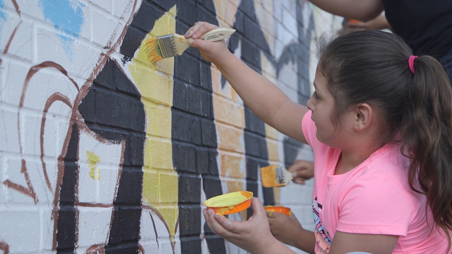  This young artist leaves a lasting mark on her community.  Photo courtesy of Jonathan Duran  