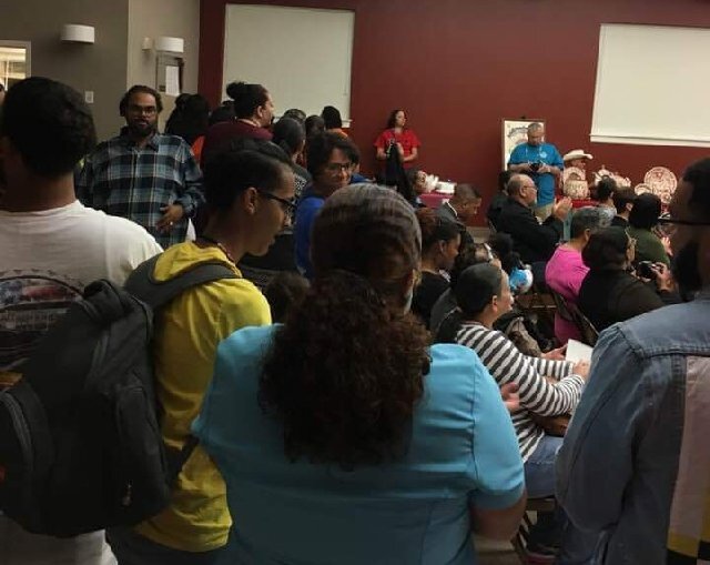  The community gathers while the artist team presents the final renderings for feedback.  Photo courtesy of Karen Harley  