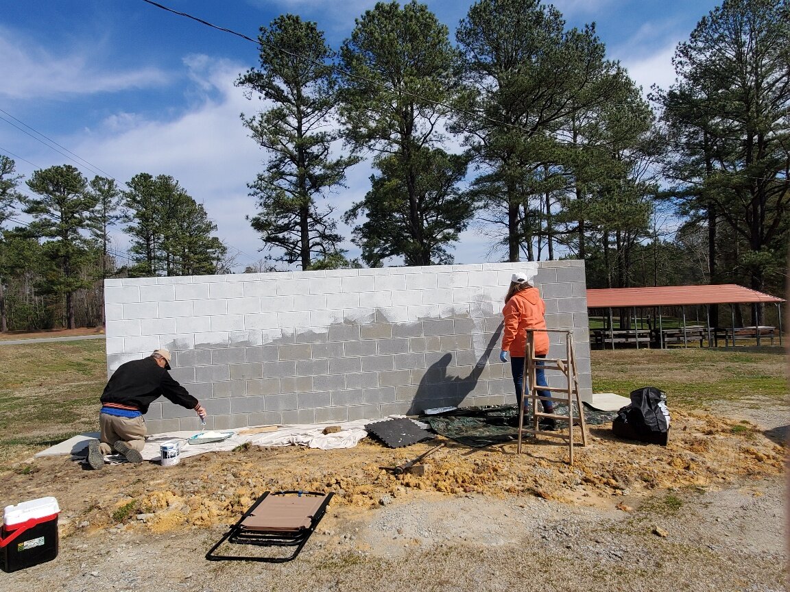  The Inclusive Public Art initiative created an opportunity to increase the visibility of the Haliwa-Saponi Tribe in the greater community. To maximize this opportunity, the project team chose this well-traveled location and constructed a wall to pro