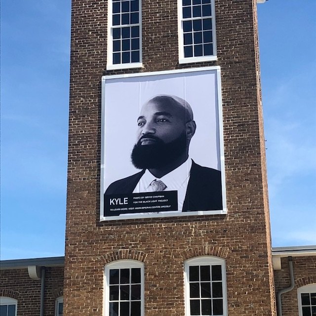  The banner portrait of Kyle Johnson enjoys a prominent location on the tower at Rocky Mount Mills.  Photo courtesy of Alicyn Wiedrich  