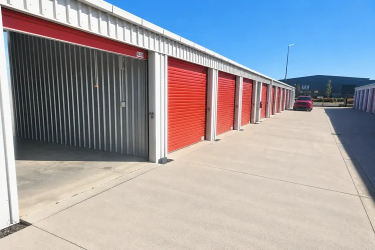 Open drive-up storage unit beside the wide concrete driveway at Storage4Less Rolleston