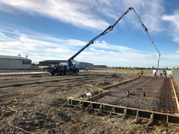 Concrete pump truck and reinforced foundation slab during construction of Storage4Less Rolleston.
