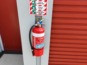Fire extinguisher mounted beside a storage unit at Storage4Less Rolleston