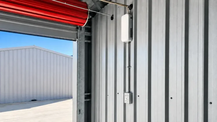 Light fitting and power socket inside a storage unit