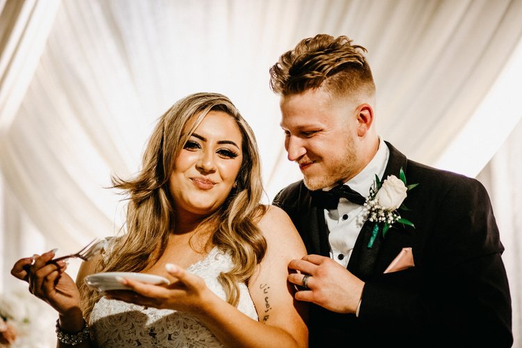 Couple laughing together on their wedding day, photographed by MYXD MEDIA