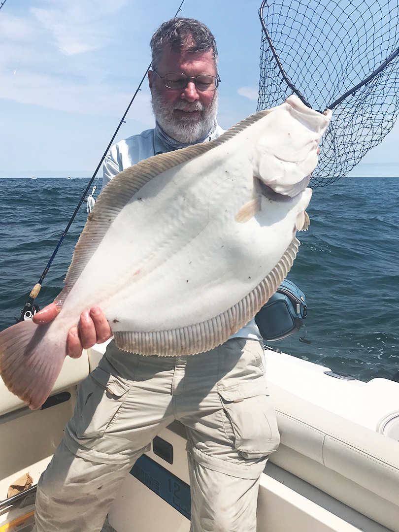 angler-john-skinner-with-huge-fluke.jpg