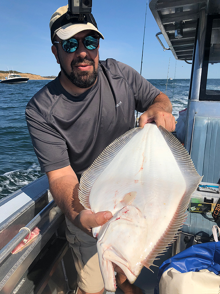 fishing-capt-with-fluke-long-island.jpg