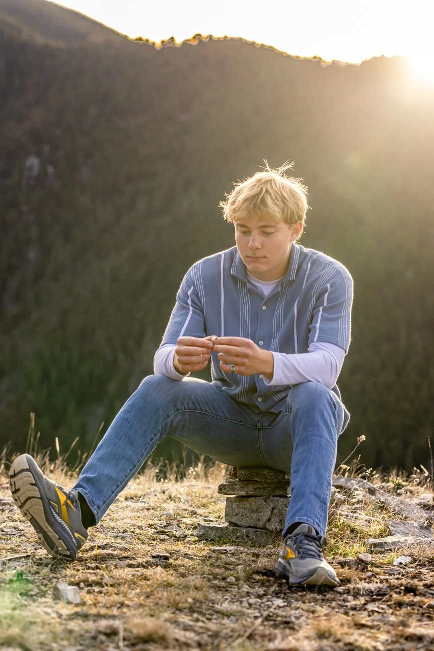 Sitting on top of a mountain just dinking around fit this young man's vision of a true Bozeman Senior Portrait.