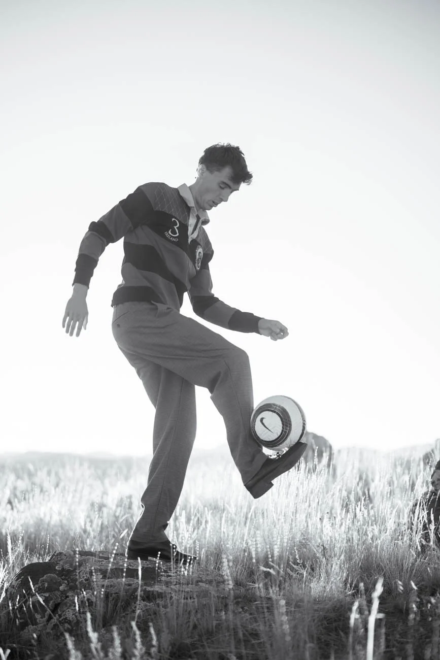 A high school senior from Bozeman juggling a soccer ball in an open field near Three Forks Montana.