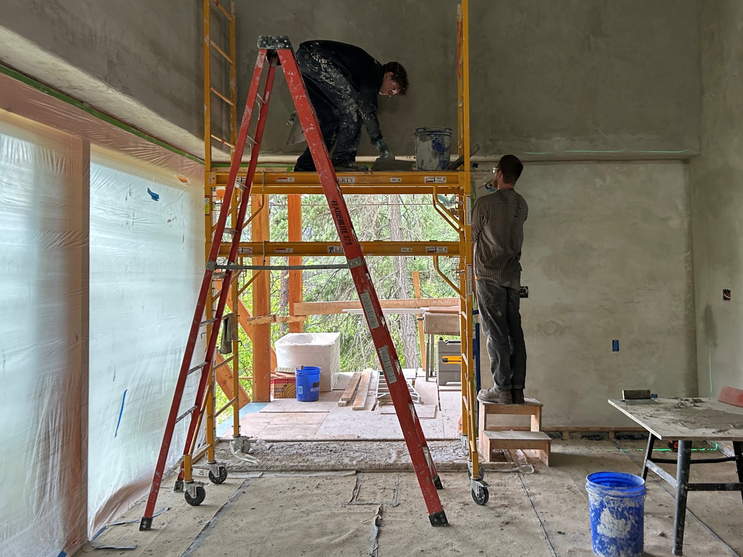 Installation of drywall at Steeps House, Kokanee Creek, BC