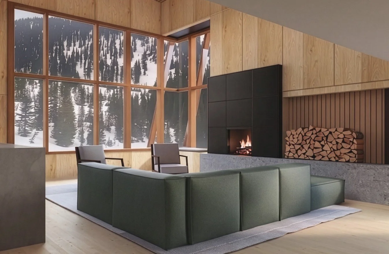 Living room with large windows showing snowy mountain trees, a black fireplace, a green sectional sofa, two armchairs, and a woodpile.