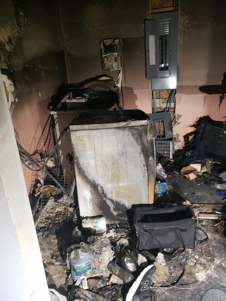 Fire caused by washing machine overheating and catching on fire, requiring fire damage restoration, smoke damage removal, cleanup, contents packout, and contents cleaning