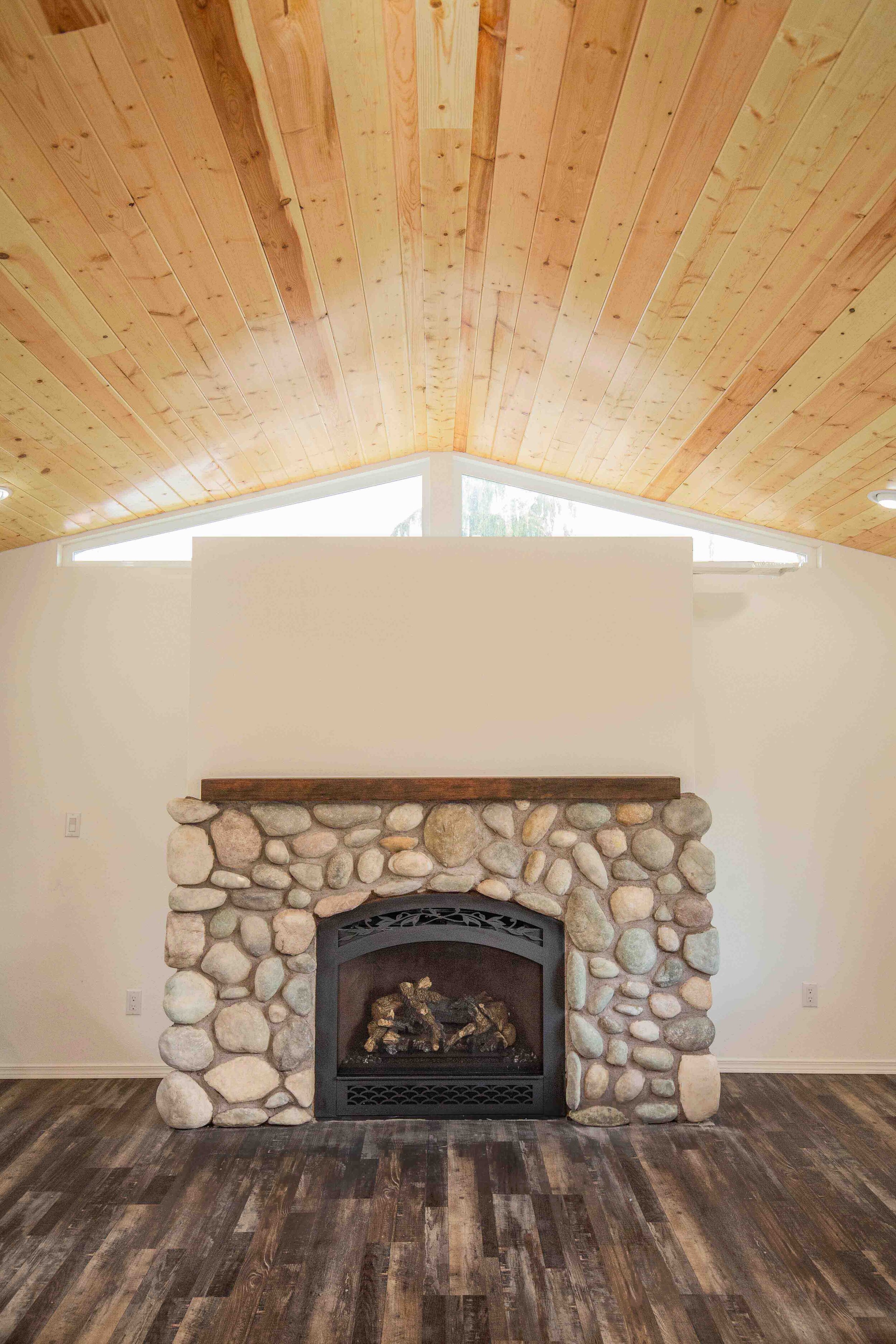 A new fireplace was curated to match the cabin-style home.