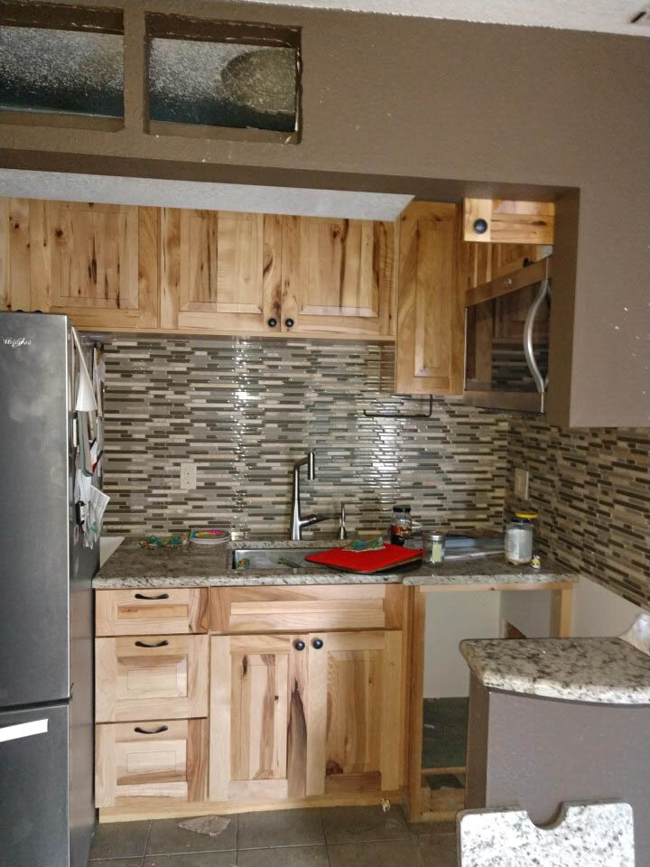 Before cleanup efforts began, it's evident the small kitchen lacked cabinetry, countertop space, and had an awkward layout.