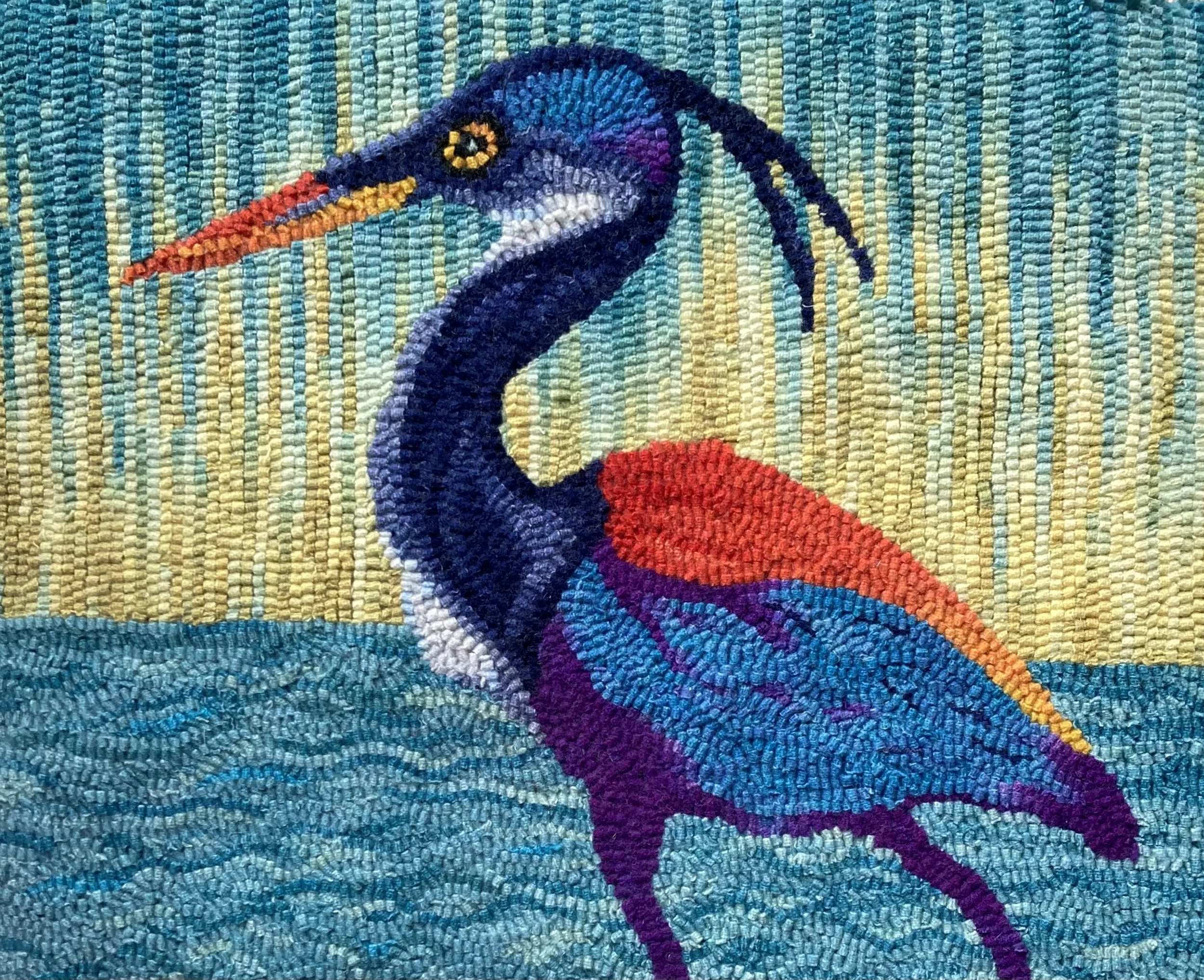 Aurora Heron. Designed and Hooked by Heidi Grevstad. Pattern will be taught at ATHA 2026 Biennial in Salt Lake City