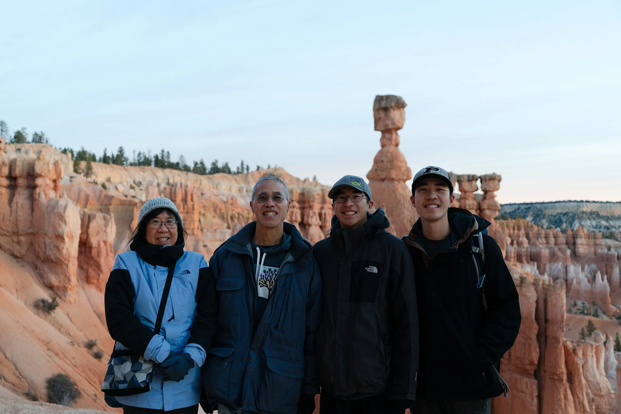 A family photo with Thor's Hammer in Bryce Canyon National Park in the background.