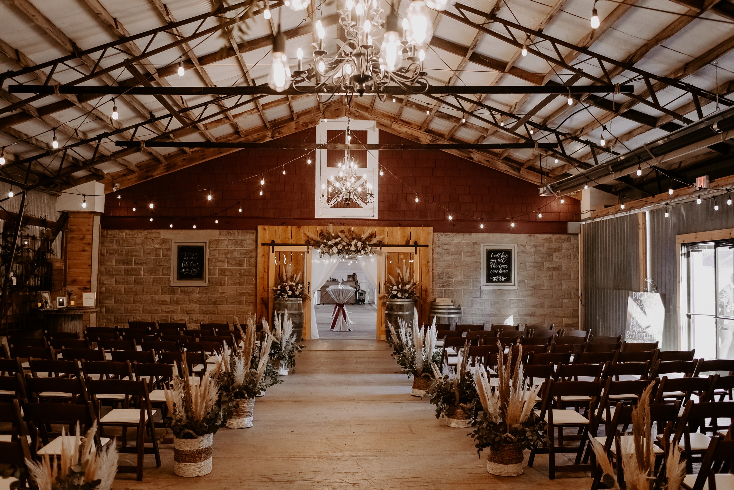 Ceremony at Covered Bridge inside the barn.jpg