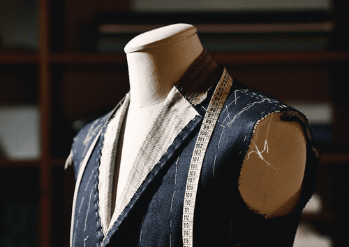 Tailor's mannequin with a measuring tape