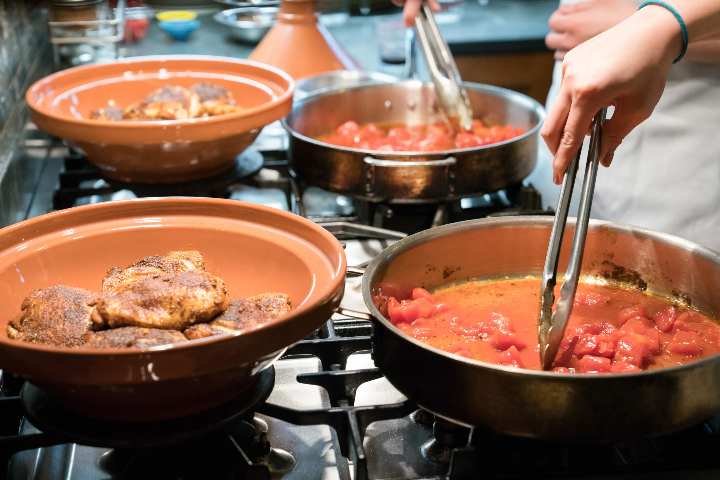 Cook-with-Chef-Traci-Team-Building-Cooking-tomatoes-for-tagine.jpg