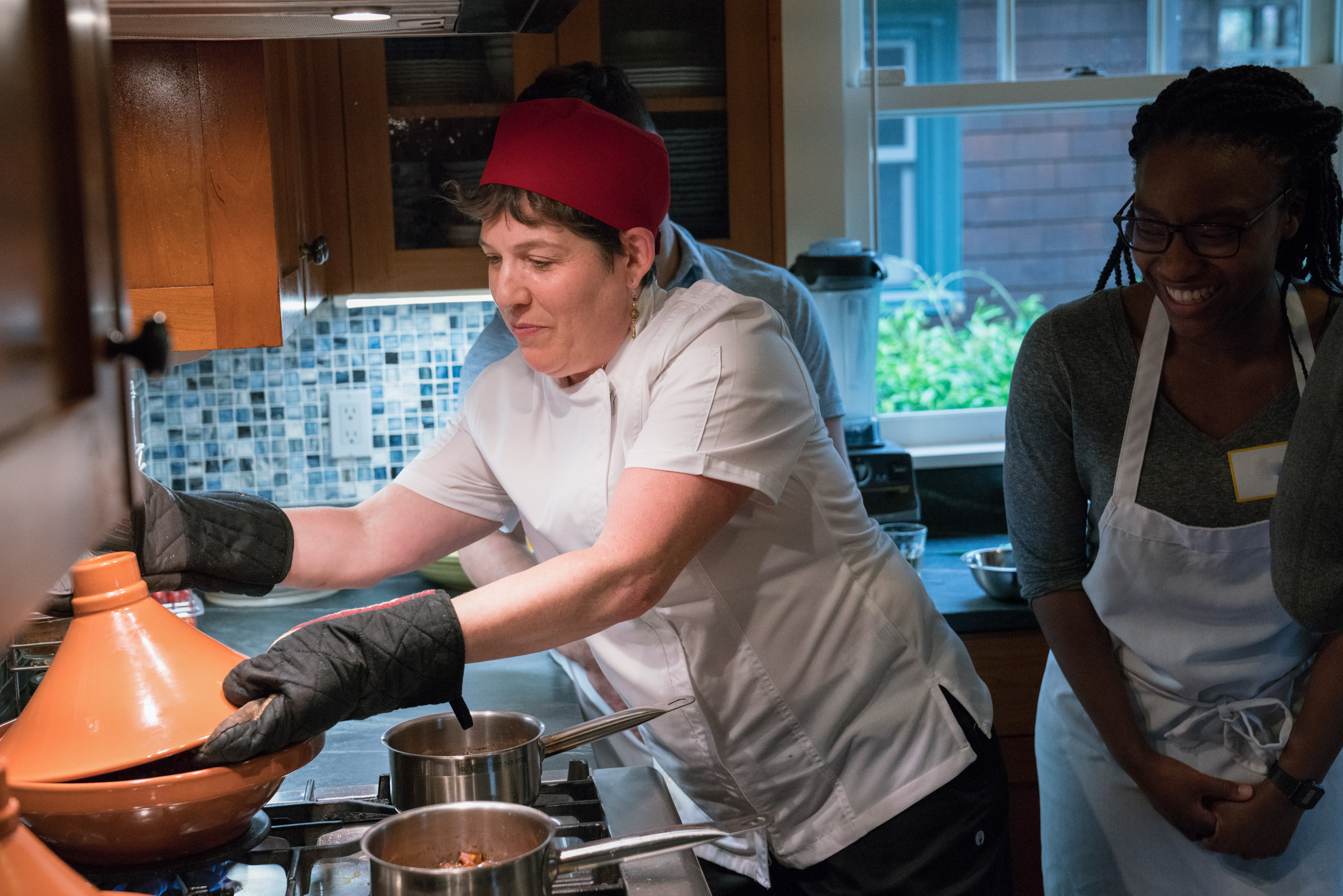 Cook-with-Chef-Traci-team-building-putting-the-lid-on-the-tagine.jpg