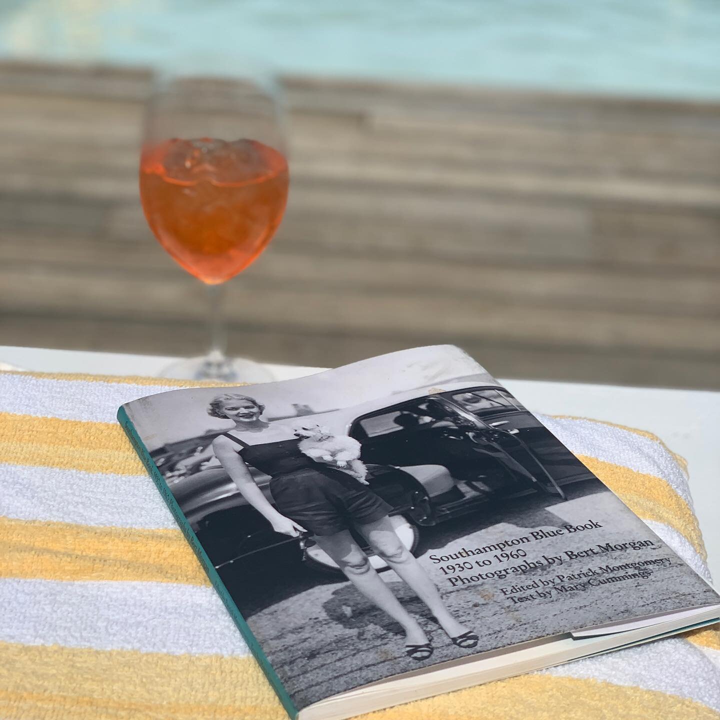 A refreshing Aperol Spritz with a light read poolside 🥂📖 #SouthamptonBlueBook #VintageFashion #CapriSouthampton #TheBathingClub #StayWithUs #BatheWithUs