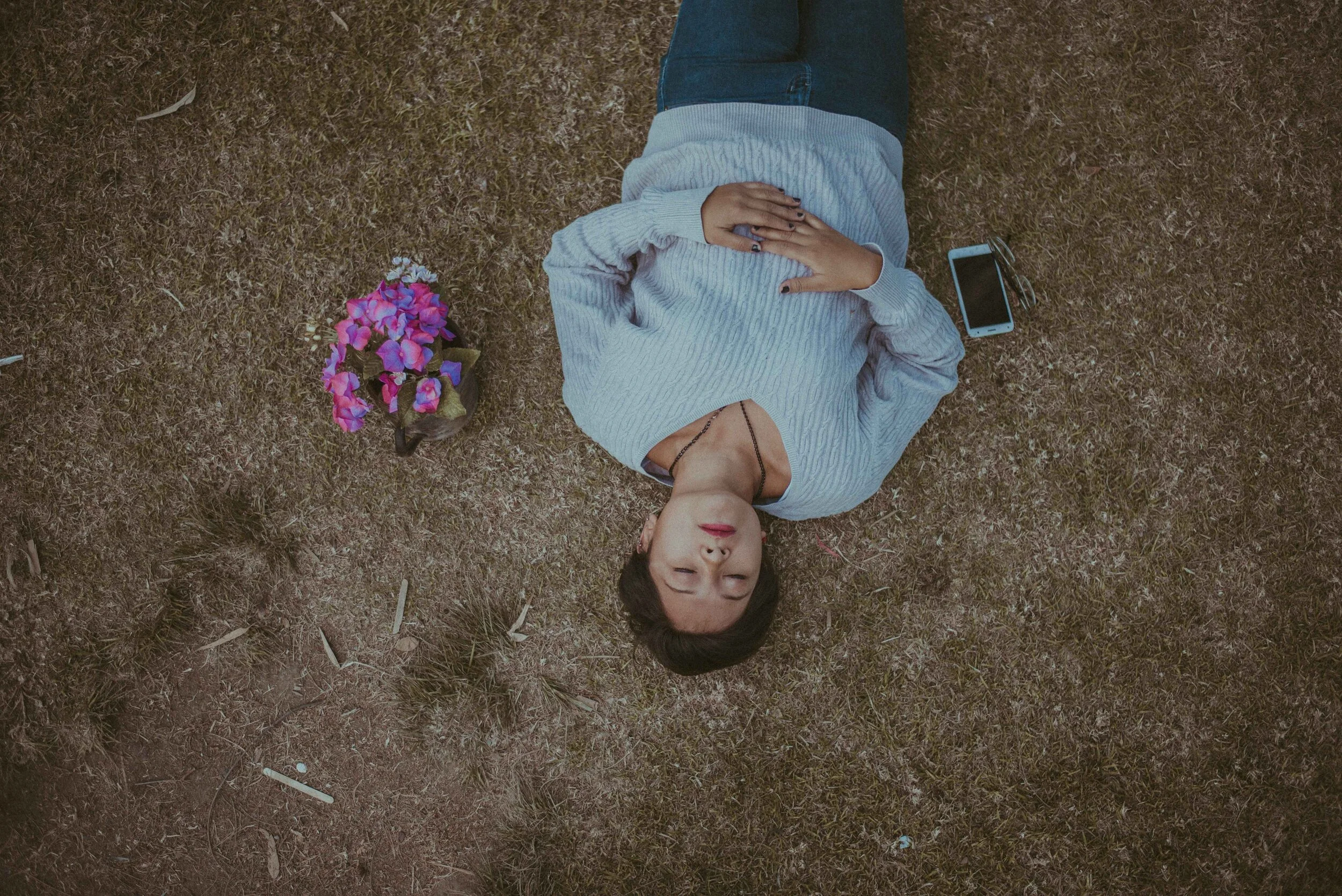 woman on ground next to phone.jpg