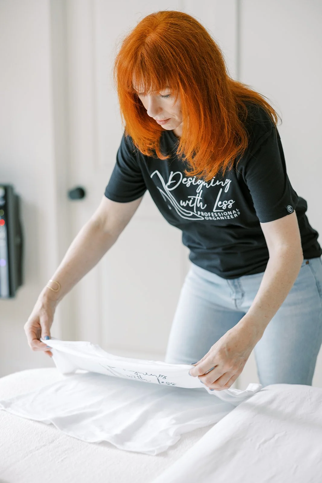 Michelle folding a t-shirt
