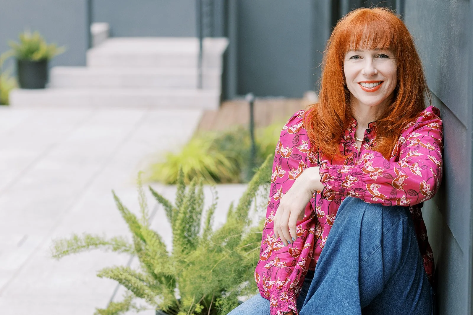 Michelle Parravani sitting outside, smiling