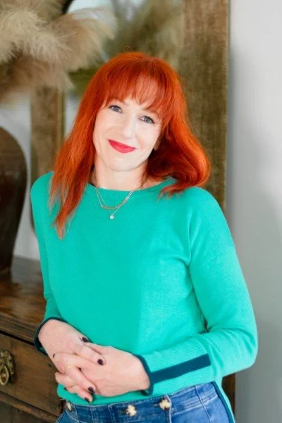 Michelle Parravani in aqua color sweater, smiling