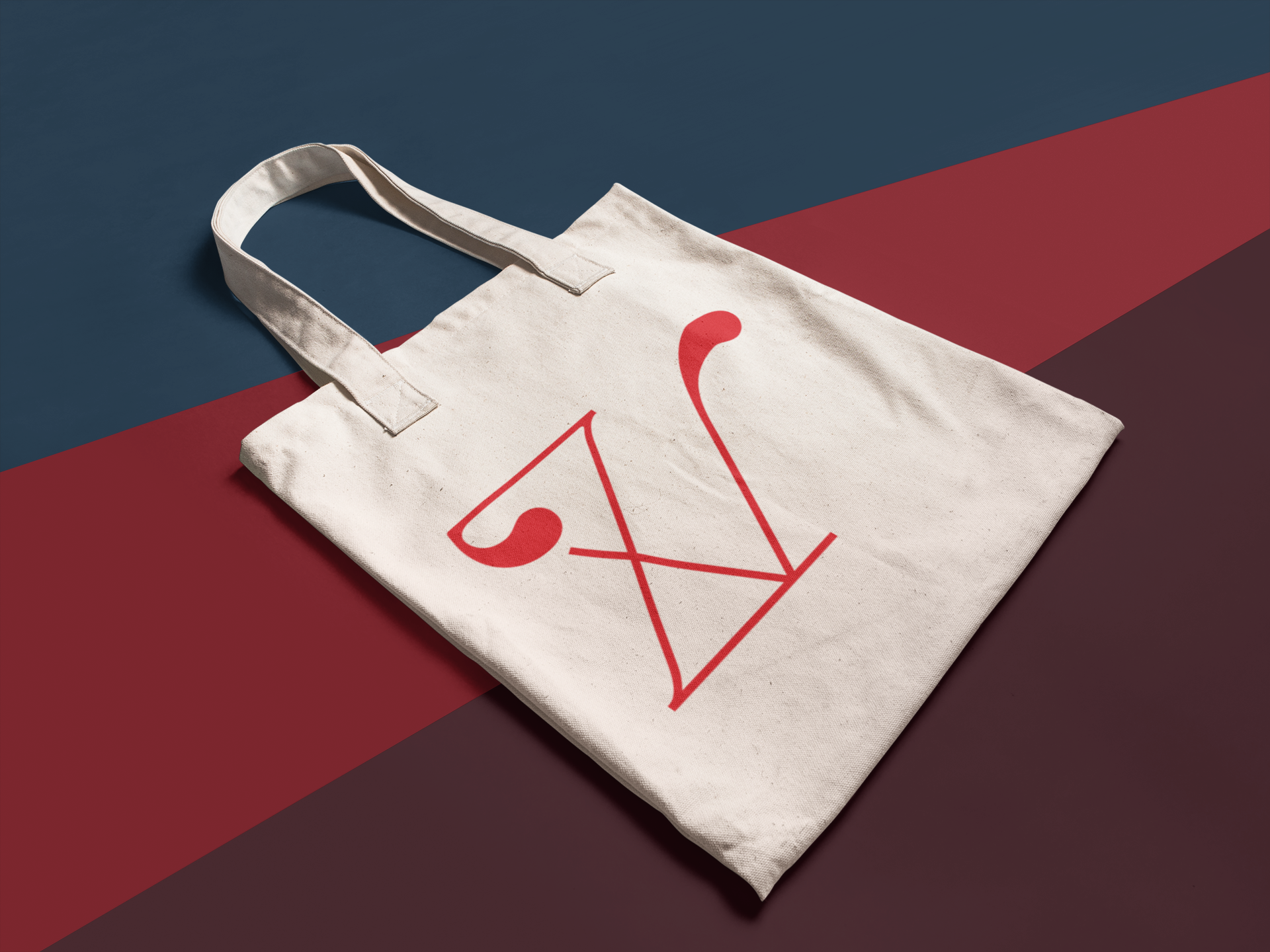 angled-mockup-of-a-tote-bag-lying-on-a-multicolor-surface-a15311.png