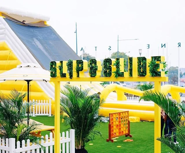 SLIP &amp; SLIDE INTO SUMMER ☀️💦
We are having a blast these holidays at @thedistrictdocklands .
.
.
Photography by: @lhaga.levent 
#showtimecreationsco #stc #events #eventmanagement #eventsplanner #eventdesign #eventstyling #eventdecor #eventspace 
