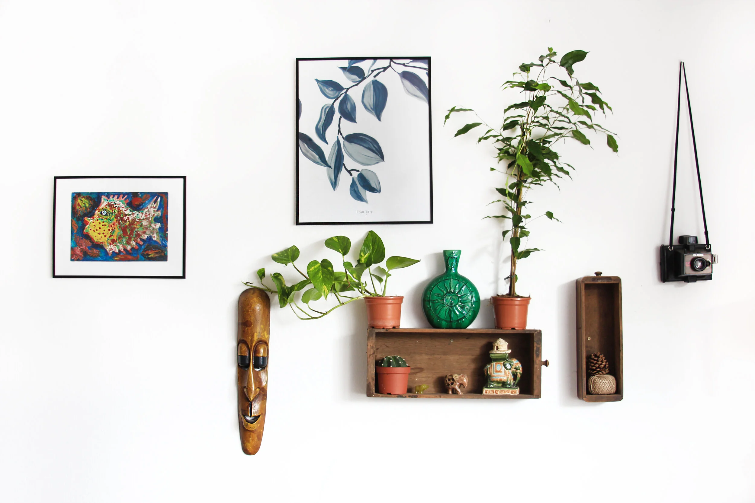 Displaying art with other collectibles is a great way to treasure your travels.