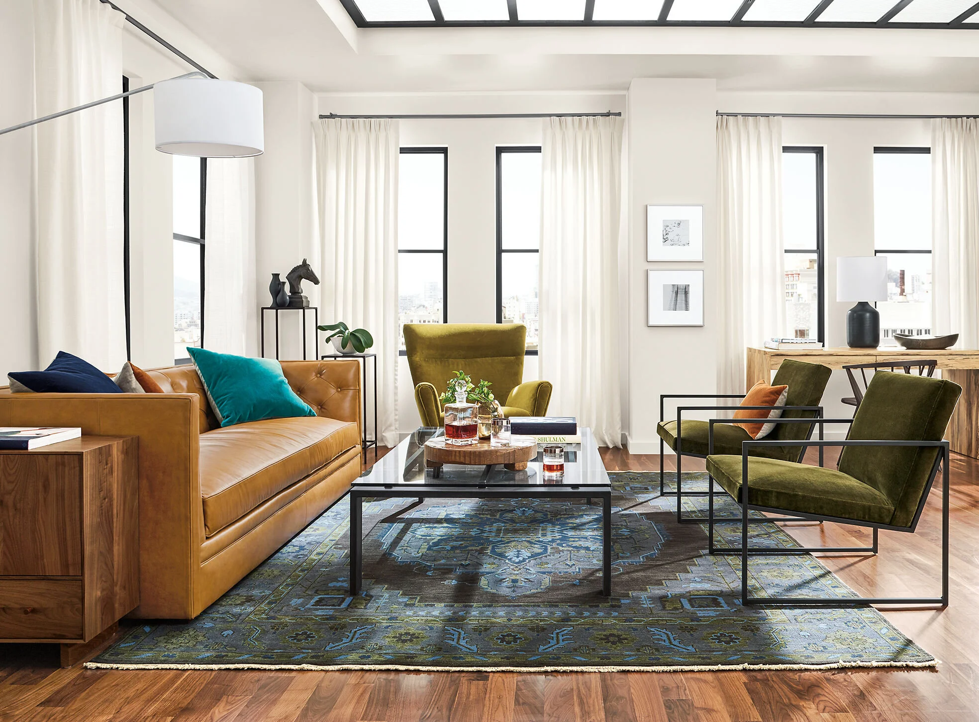 Image via Room &amp; BoardIdeally, the front legs of all the pieces of seating should be on the rug.