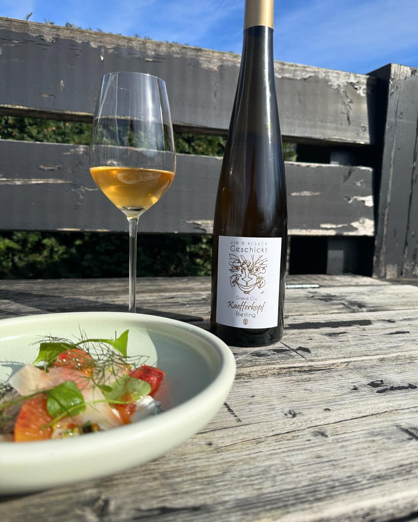 Burrata, blood orange, kosho &amp; pistachio paired with Grand Cru Riesling from Geschickt. Kaefferkopf&rsquo;s hill adds depth, body, and minerality to this Riesling. A 3-year lees maturation unveils thrilling hints of candied lemon and ginger. By t