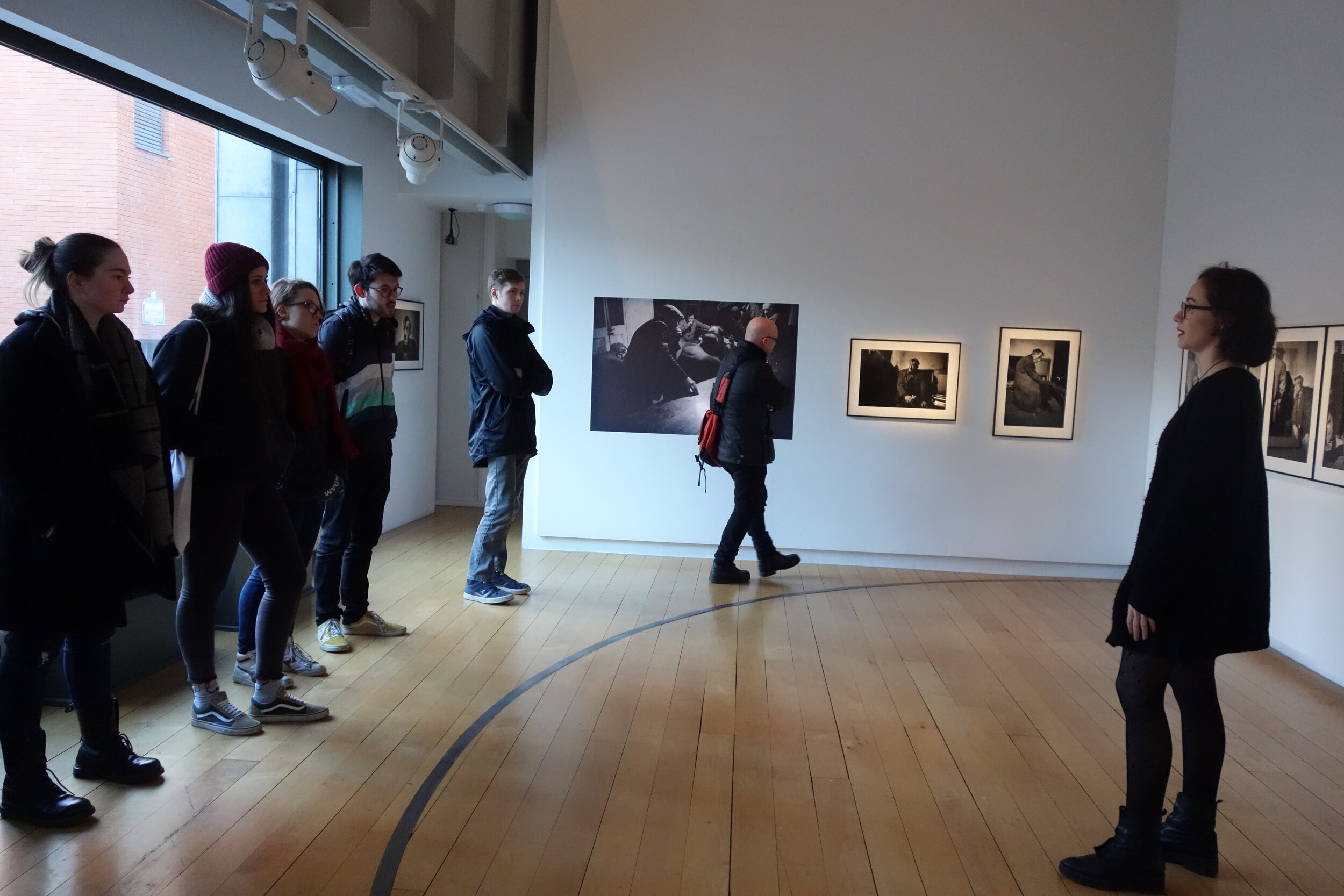  Julia giving a tour of the exhibition 