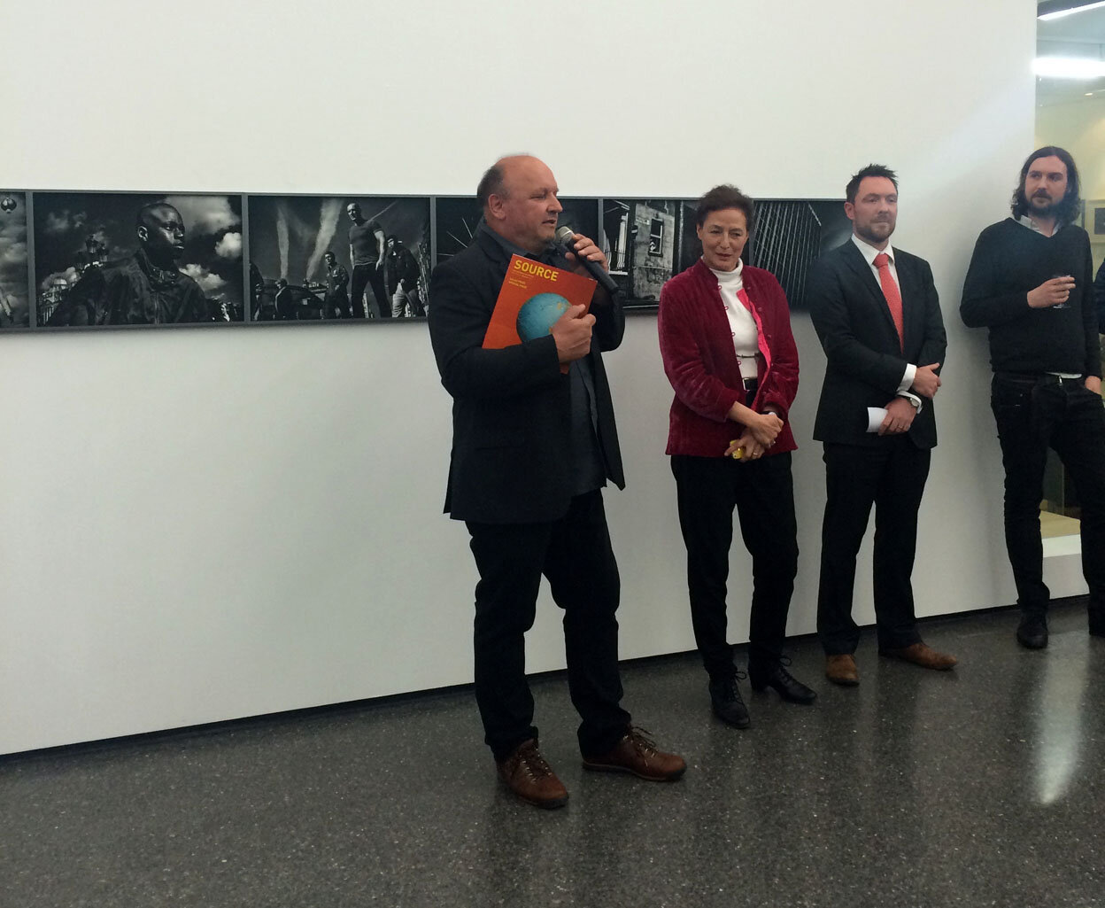  FOTOHOF Curator Herman Seidl (speaking) and GOP Curator Tanya Kiang at the opening of the exhibition in Salzburg 